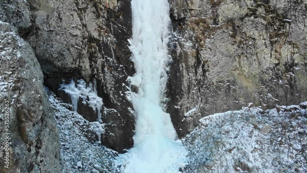Caucasus, North Ossetia. Tsey Gorge. Ice stream on the rocks. Caucasus, North Ossetia. Tsey Gorge. Ice stream on the rocks.