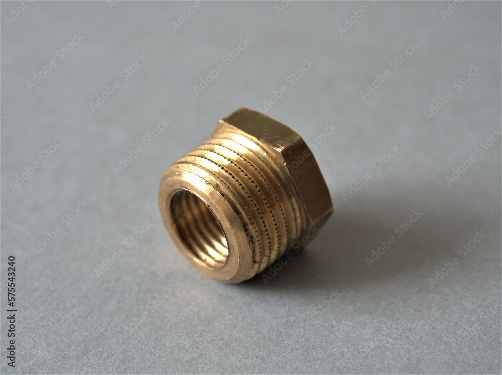 Brass reduction transition for installation in water supply and central heating systems. Bush reducing threaded pipe fitting Brass reduction transition for installation in water supply and central heating systems. Bush reducing threaded pipe fitting