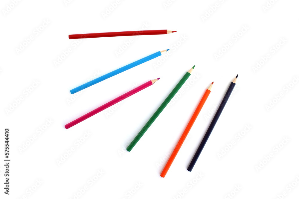  Colored pencils lie on a white isolated background from the top angle.
