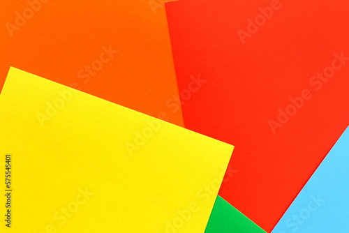 Bright abstract background from multi-colored paper cardboard. 