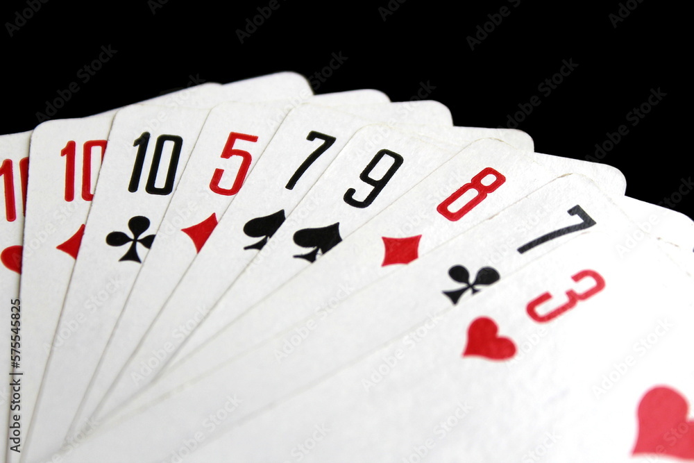 Playing cards lie on a black isolated background. Playing cards lie on a black isolated background.