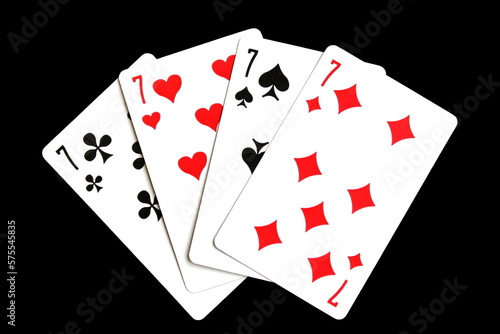 Playing cards lie on a black isolated background.