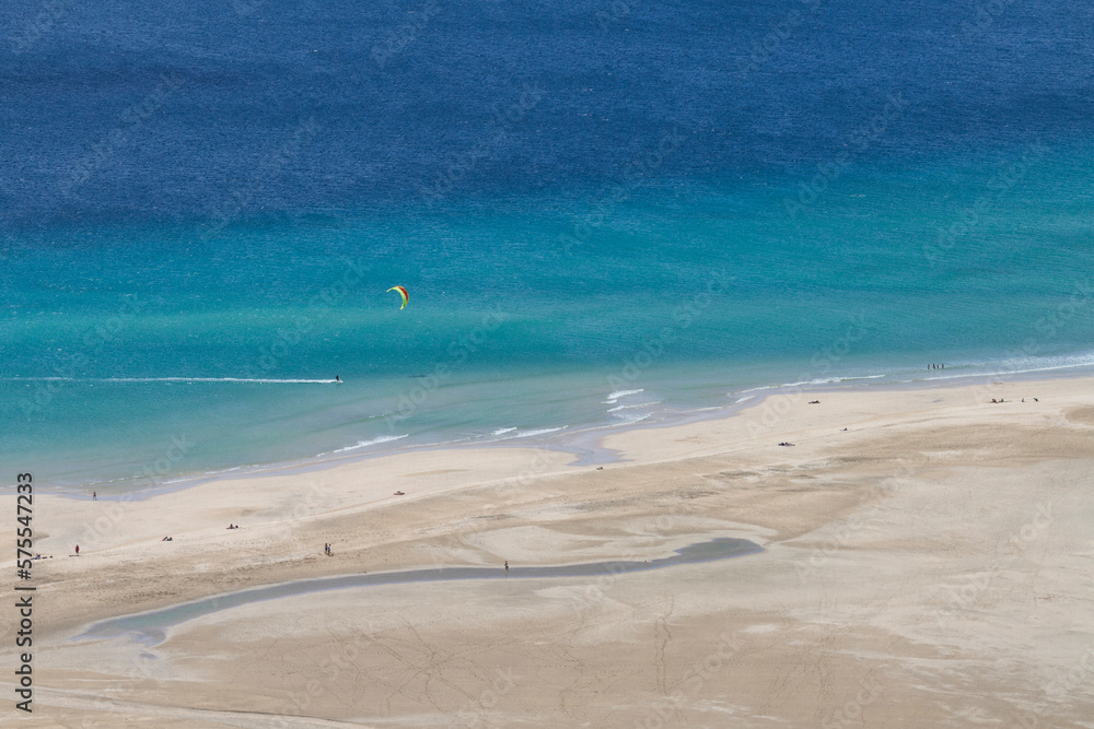 Aerial photo of a kitesurfer in Fuerteventura's famous Sotavento beach. In Sotavento beach every year the kitesurf and windsurf world championship is held. Aerial photo of a kitesurfer in Fuerteventura's famous Sotavento beach. In Sotavento beach every year the kitesurf and windsurf world championship is held.