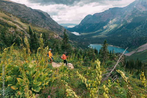 Couple hiking, Glacier National Park, Montana, USA photo