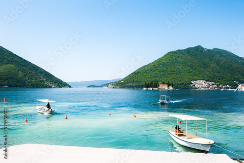 Tourist boats at the bay pier of Perast town. Kotor bay, Montenegro