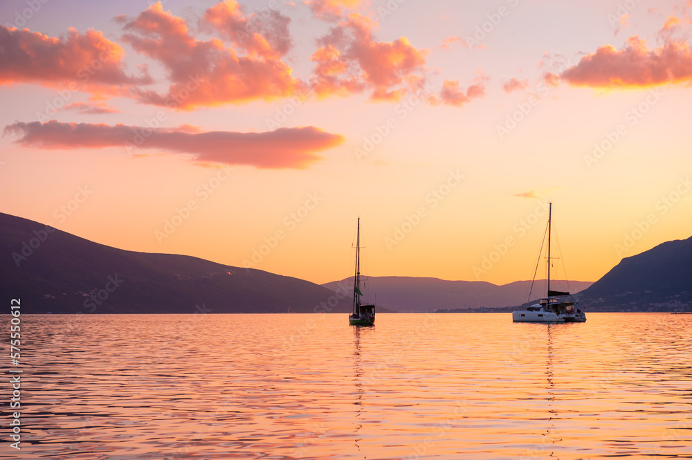 Yacht in the Kotor bay, Montenegro. Summer landscape at sunset.
