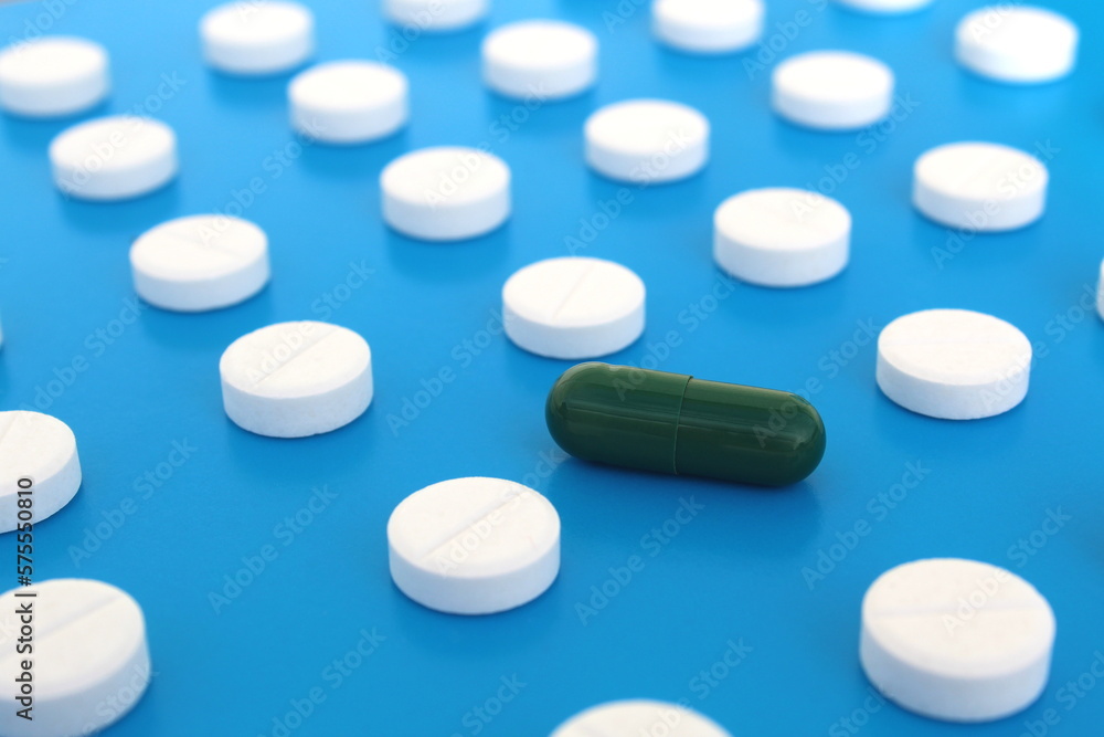 Abstract background of white pills on a blue background. Abstract background of white pills on a blue background.