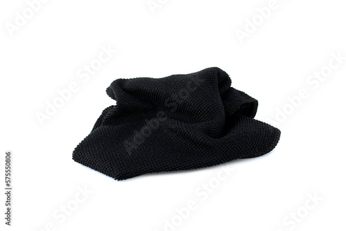  A black rag for cleaning lies on a white isolated background.