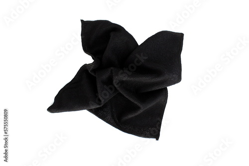 A black rag for cleaning lies on a white isolated background.