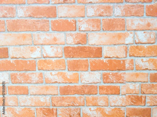 red brick wall with white cement surface.