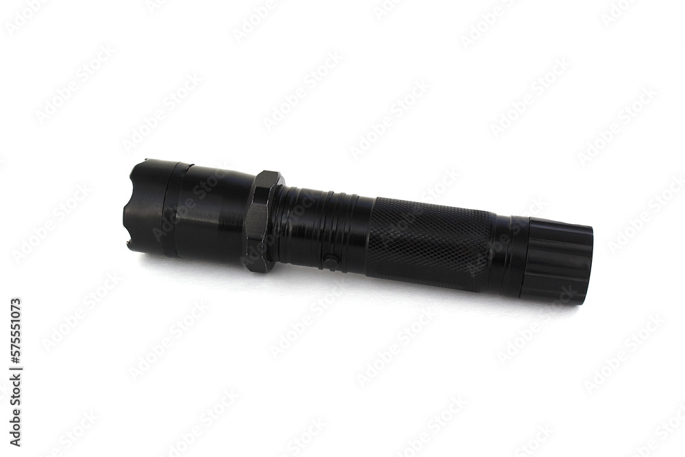 On a white background lies a shocker and a flashlight in one device. On a white background lies a shocker and a flashlight in one device.