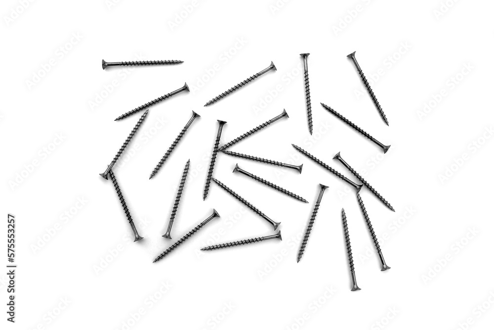 A lot of self-tapping screws lie on a white isolated background.
