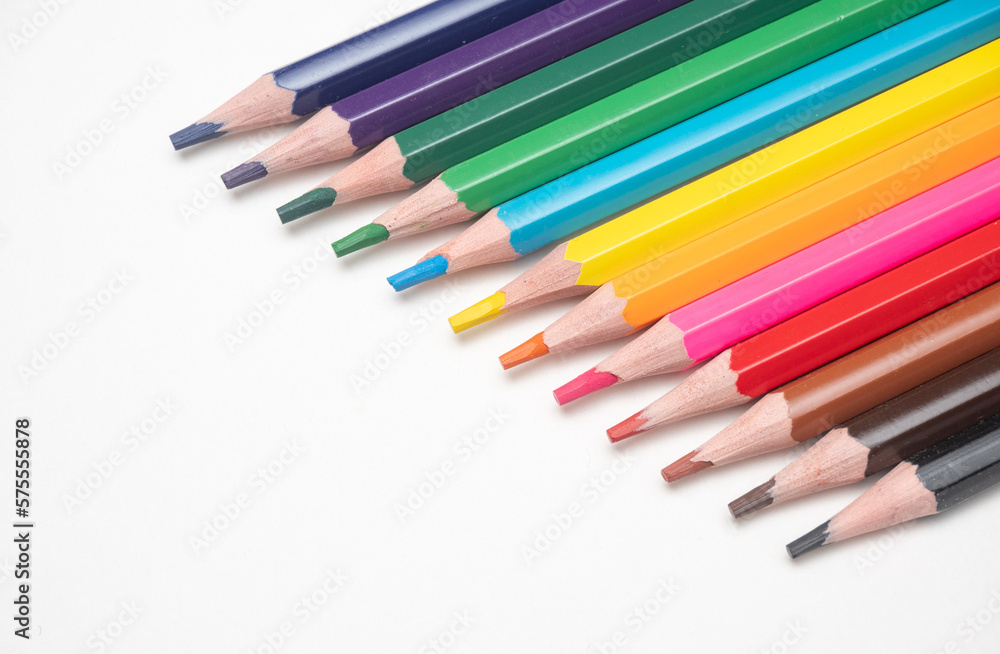 Naklejka premium color pencils on white background