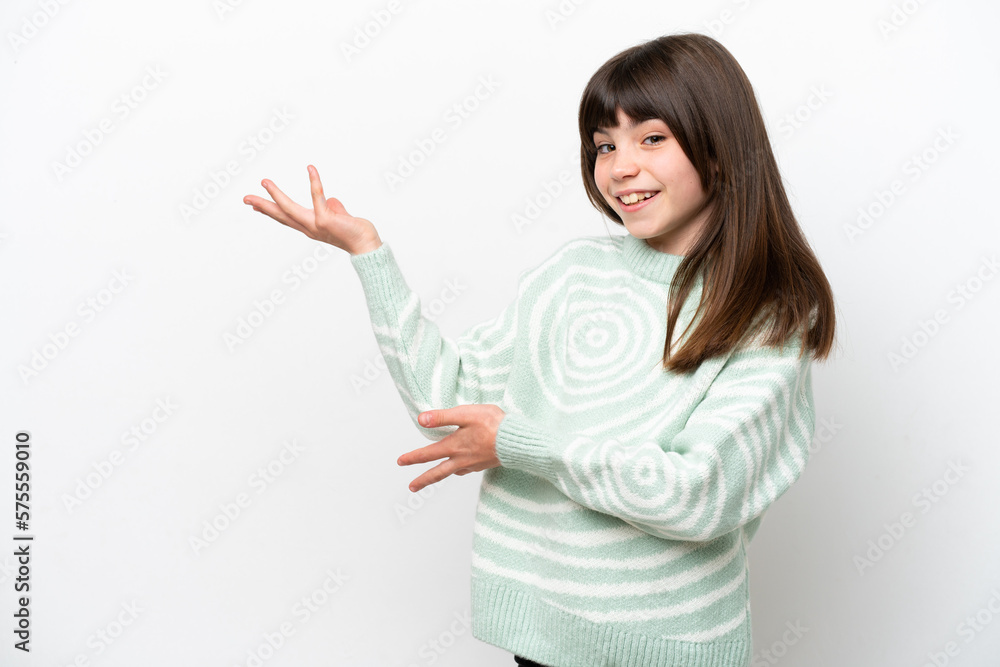 Little caucasian girl isolated on white background extending hands to the side for inviting to come Little caucasian girl isolated on white background extending hands to the side for inviting to come