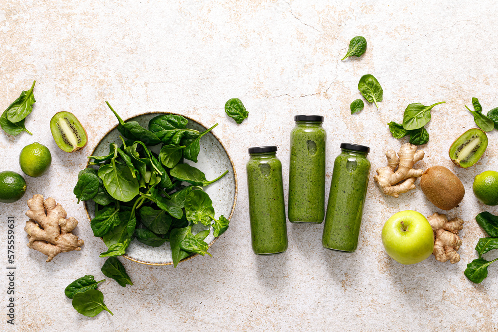 Smoothie. Healthy fresh raw detox spinach smoothie with green apple, kiwi and ginger in a bottles on a table. Healthy diet vegan food full of antioxidants. Top view - obrazy, fototapety, plakaty 