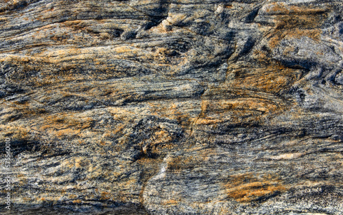 The surface texture of the granite stone is close-up.