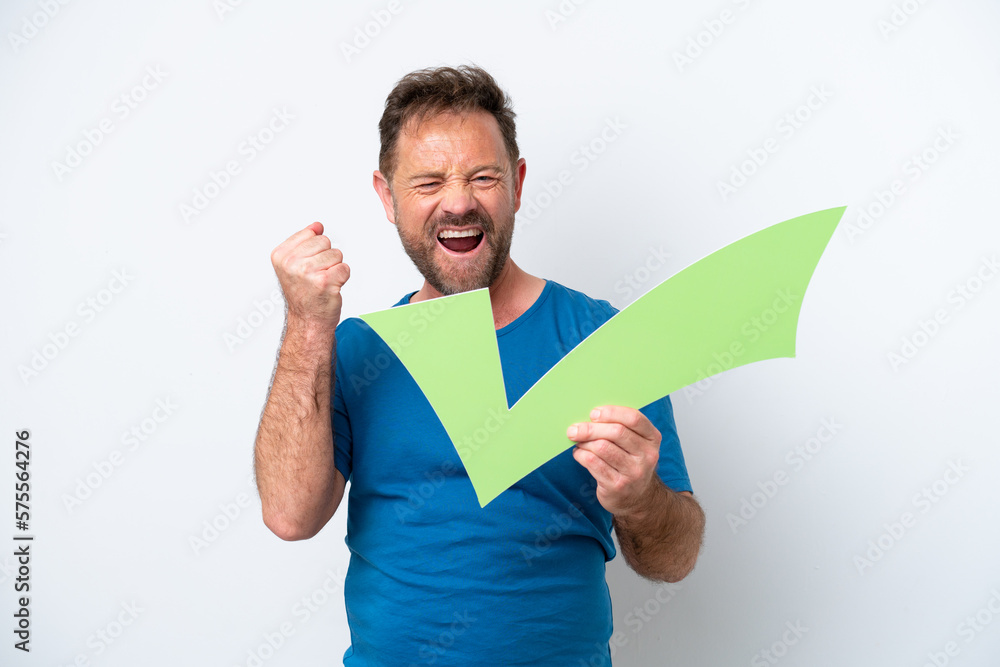 Middle age caucasian man isolated on white background holding a check icon and celebrating a victory Middle age caucasian man isolated on white background holding a check icon and celebrating a victory