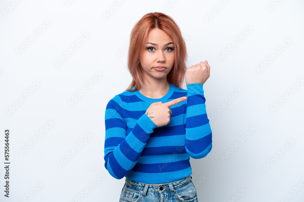 Fototapeta premium Young Russian girl isolated on white background making the gesture of being late