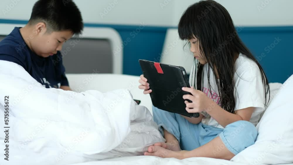 two children addicted tablet, asian kid watching cartoon
two children addicted tablet, asian kid watching cartoon