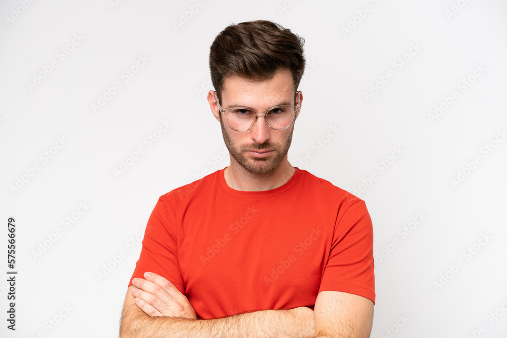 Young caucasian man isolated on white background With glasses and arms crossed Young caucasian man isolated on white background With glasses and arms crossed
