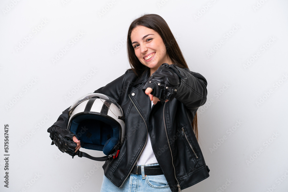 Young girl with a motorcycle helmet isolated on white background pointing front with happy expression Young girl with a motorcycle helmet isolated on white background pointing front with happy expression
