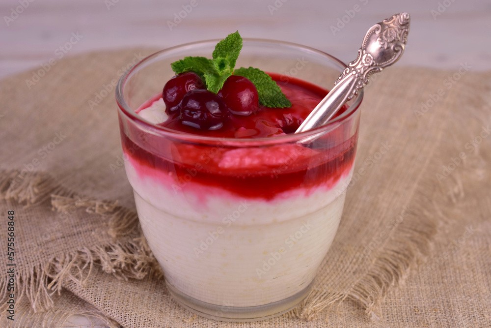 Rice pudding with cherry jam. Close-up.
Rice pudding with cherry jam. Close-up.