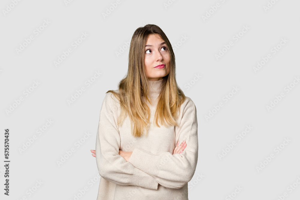 Young blonde posing for a portrait isolated, exuding natural beauty and radiance dreaming of achieving goals and purposes Young blonde posing for a portrait isolated, exuding natural beauty and radiance dreaming of achieving goals and purposes
