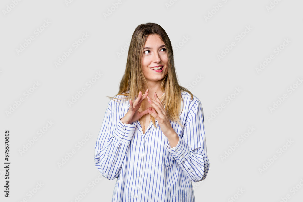Young blonde posing for a portrait isolated, exuding natural beauty and radiance making up plan in mind, setting up an idea. Young blonde posing for a portrait isolated, exuding natural beauty and radiance making up plan in mind, setting up an idea.