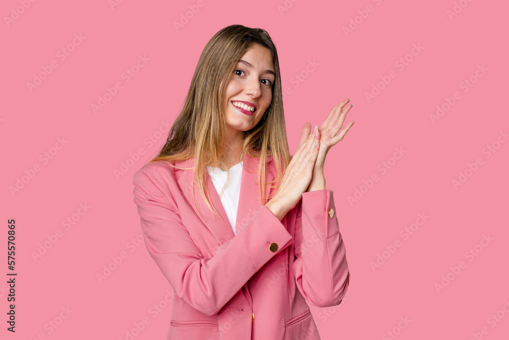 Young blonde posing for a portrait isolated, exuding natural beauty and radiance feeling energetic and comfortable, rubbing hands confident. Young blonde posing for a portrait isolated, exuding natural beauty and radiance feeling energetic and comfortable, rubbing hands confident.