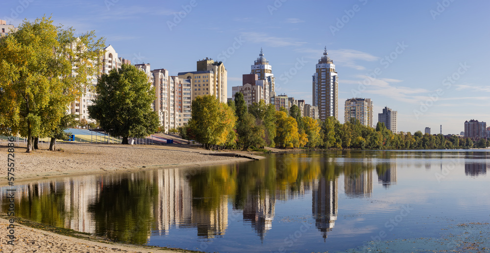 Modern apartment complex with multistory buildings on the river bank Modern apartment complex with multistory buildings on the river bank