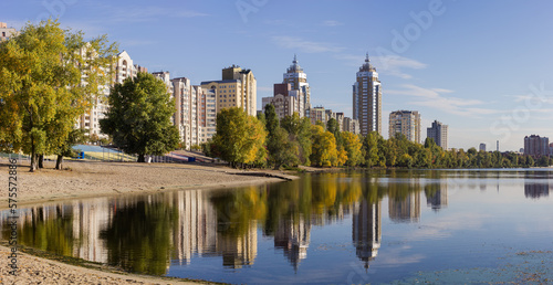 Modern apartment complex with multistory buildings on the river bank