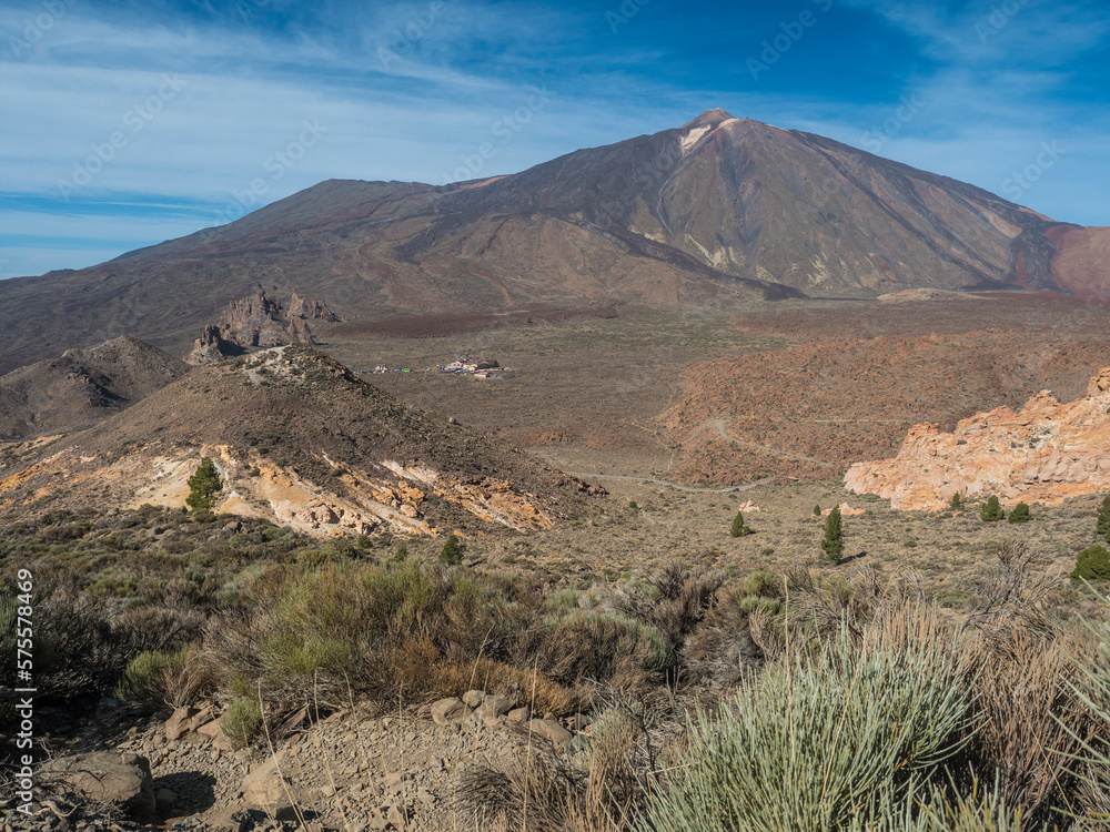Close up view on colorful volcano pico del teide highest spanish mountain in Tenerife Canary island from hiking trail to peak Alto de Guajara with blue sky background. Horizontal Close up view on colorful volcano pico del teide highest spanish mountain in Tenerife Canary island from hiking trail to peak Alto de Guajara with blue sky background. Horizontal