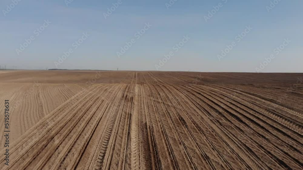 Green tractor planting sunflower on the sandy field in Ukraine 4K Green tractor planting sunflower on the sandy field in Ukraine 4K