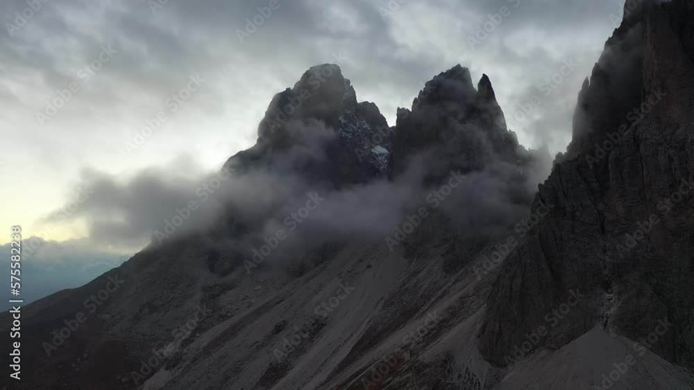 Tracking drone video showing low level clouds covering the Dolomites, Italy 
