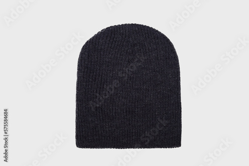 Gray men's knitted classic hat isolated on white background. Winter wool beanie hat, headwear. Templates, mock up, Men's cap for winter. Flat lay photo