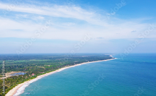 Aerial view of the tropical ocean landscape with a beach. Beautiful southern sea wallpaper for tourism and advertising. Asian landscape, drone photo