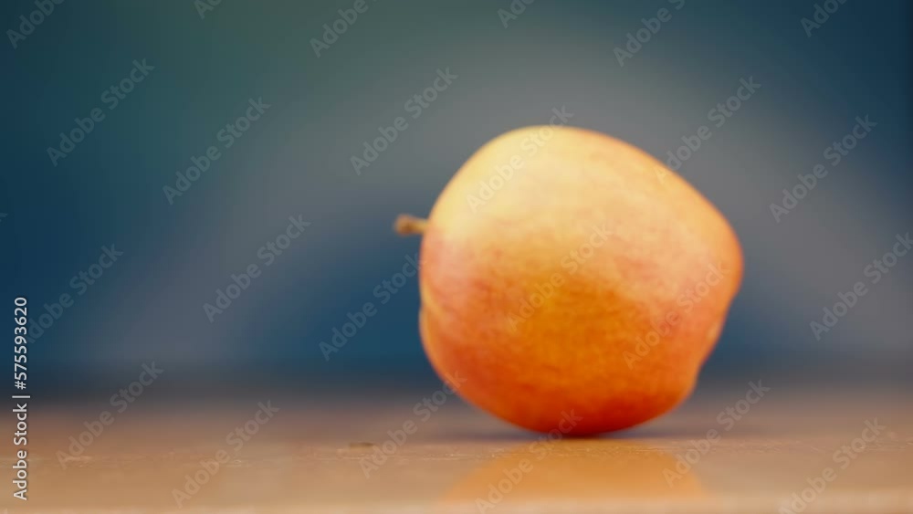 Closer look of the rolling apple on the table inside the kitchen in Estonia Closer look of the rolling apple on the table inside the kitchen in Estonia