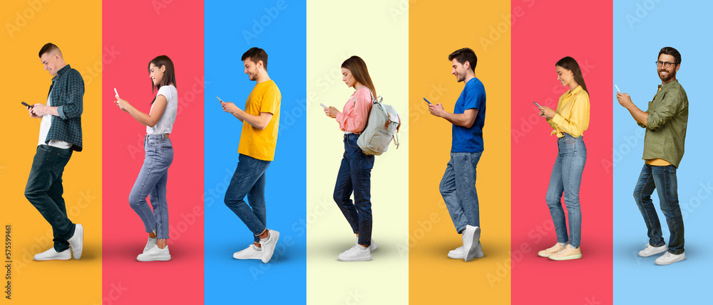 Obraz premium Smiling busy young european people in casual typing on smartphones, watch video