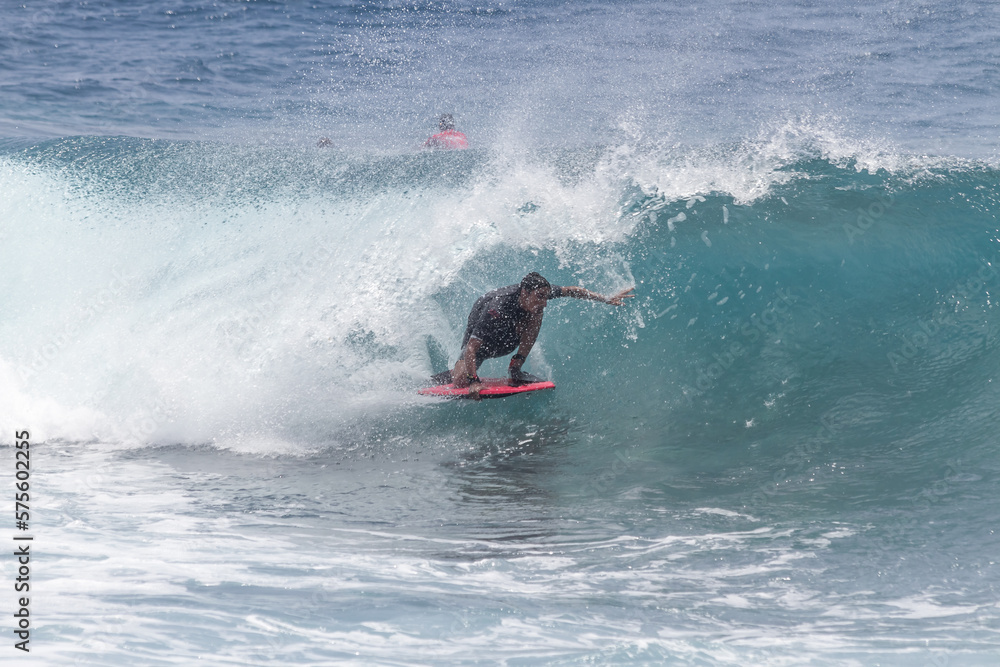 TENERIFE, SPAIN 11- AUGUST- 2013: boy competing in men's bodyboard championship. Tenerife, Canary Islands, Spain: boy competing in a bodyboarding championship, performing incredible maneuvers TENERIFE, SPAIN 11- AUGUST- 2013: boy competing in men's bodyboard championship. Tenerife, Canary Islands, Spain: boy competing in a bodyboarding championship, performing incredible maneuvers