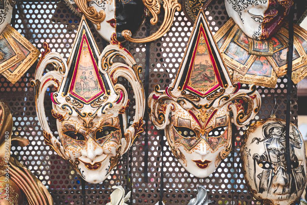 Fototapeta premium Two carnival masks in Venice, typical in the streets of the city and used in parties, theater and performances. Shrove Tuesday