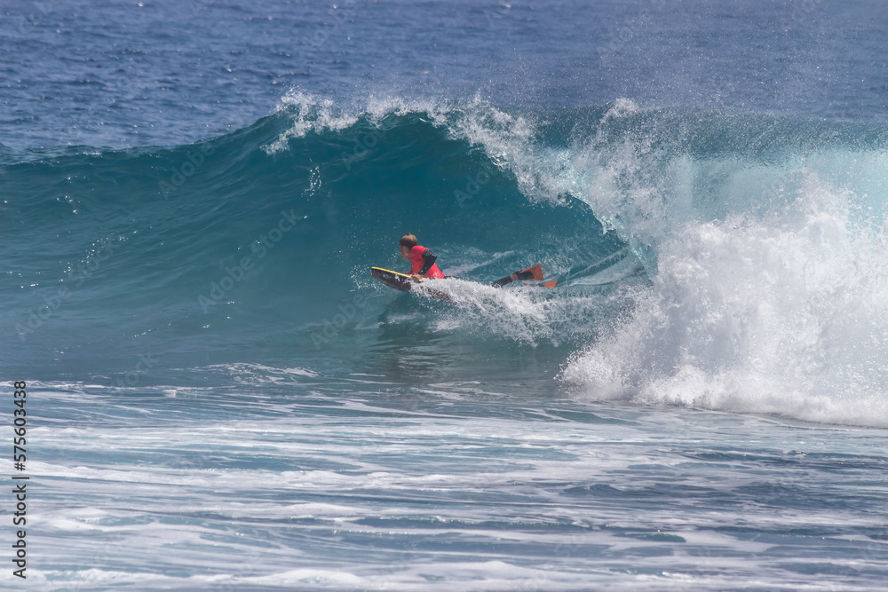 Obraz premium TENERIFE, SPAIN 11- AUGUST- 2013: boy competing in men's bodyboard championship. Tenerife, Canary Islands, Spain: boy competing in a bodyboarding championship, performing incredible maneuvers