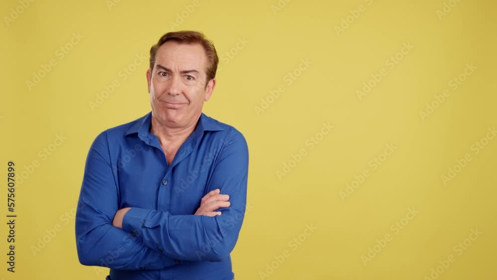 Happy mature man looking aside with arms crossed Happy mature man looking aside with arms crossed