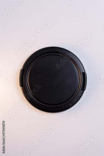 black protective cover for the camera lens, isolated on a white background