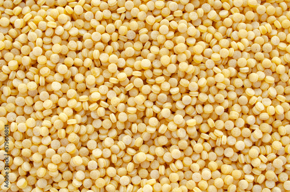 Ptitim background closeup, top view. Israeli heap of couscous, background, texture, top view. Heap of ptitim, background, texture, top view. Ptitim background closeup, top view. Israeli heap of couscous, background, texture, top view. Heap of ptitim, background, texture, top view.
