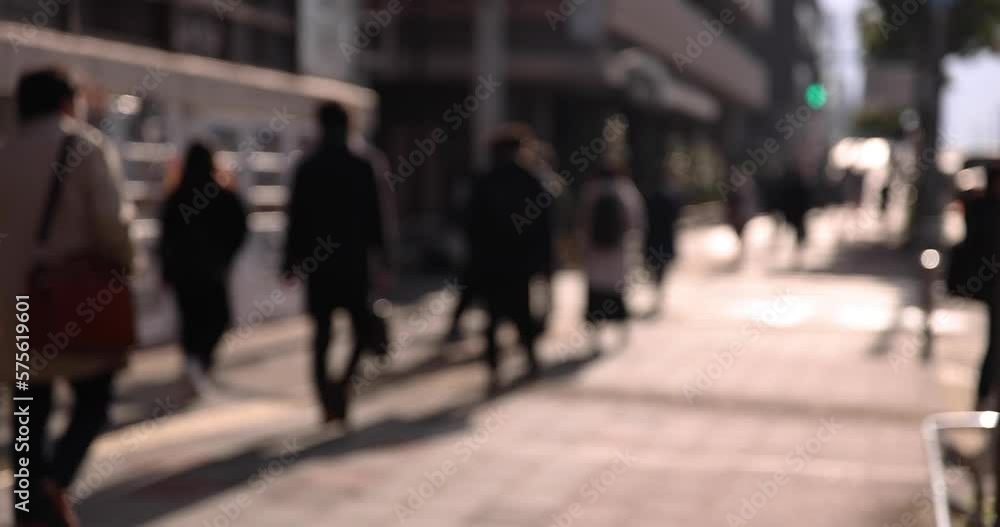 A slow motion of walking people on the city street A slow motion of walking people on the city street