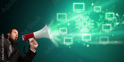 Young person with megaphone and technology related icon