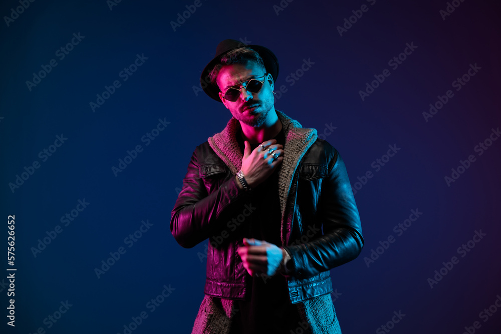 casual man posing with hands around his body casual man posing with hands around his body