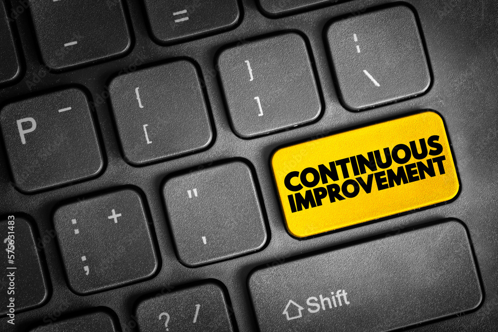 Fototapeta premium Continuous Improvement text button on keyboard, business concept background