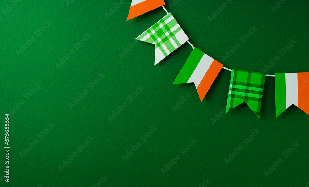 Saint Patrick day concept flat lay with garland flag, and on yellow background - obrazy, fototapety, plakaty 