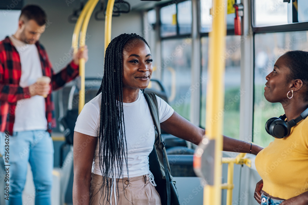 African american woman with braids riding in a bus